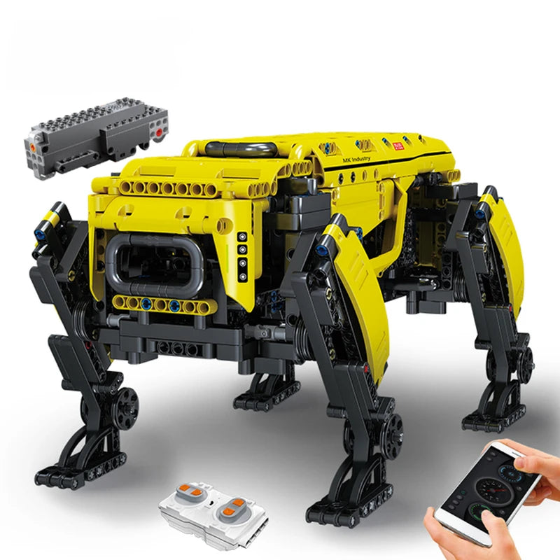Yellow and black robot model built from interlocking bricks with remote controls on a white background