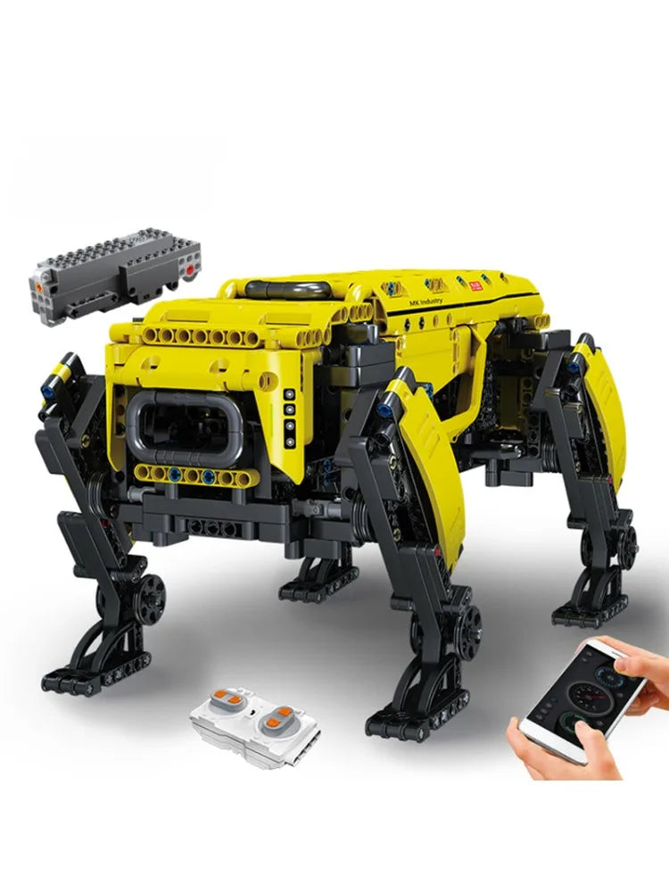 Yellow and black robot model with remote control on a white background